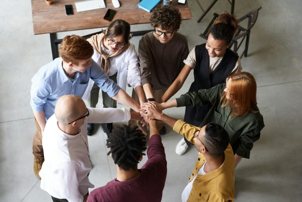 photo of people holding each other s hands