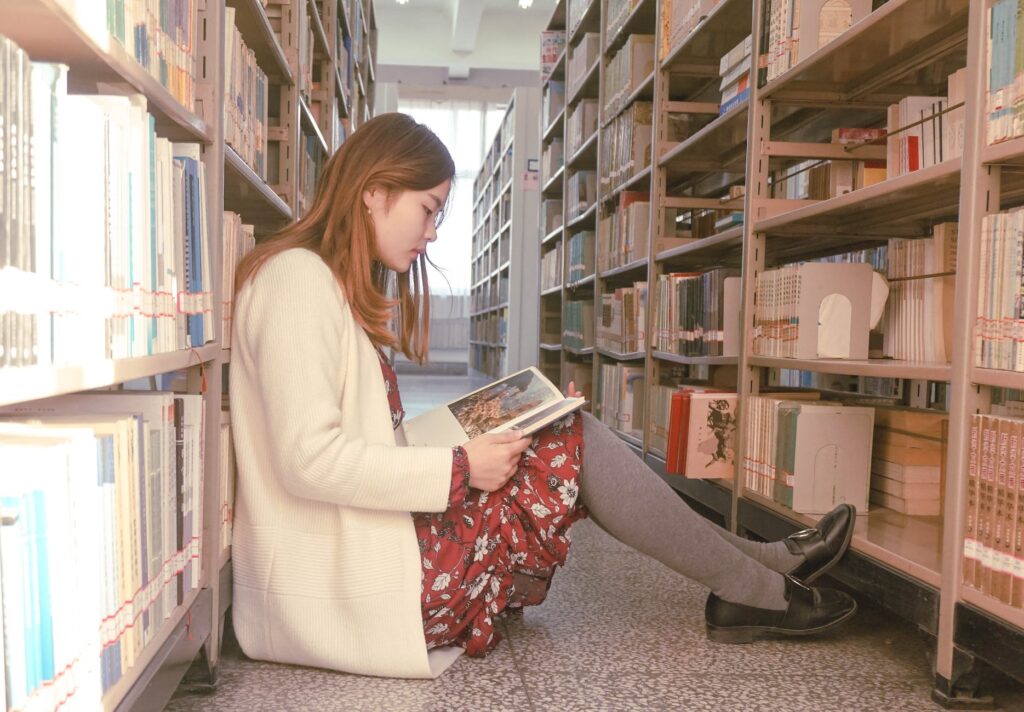 photo of a woman reading book