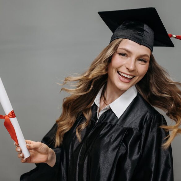 photo of happy woman holding diploma