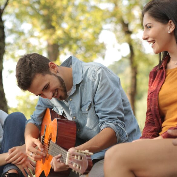 friends spending time together with guitar