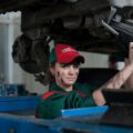 woman holding gray steel wrench